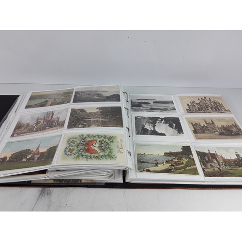 36 - Four albums of postcards