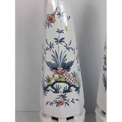 30 - A pair of Italian porcelain obelisks with floral pattern, signed by Ian Lewis