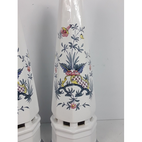 30 - A pair of Italian porcelain obelisks with floral pattern, signed by Ian Lewis
