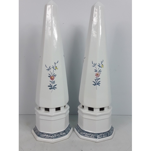30 - A pair of Italian porcelain obelisks with floral pattern, signed by Ian Lewis