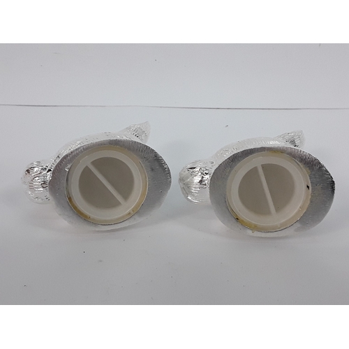 55 - A pair of hare salt & pepper cruets