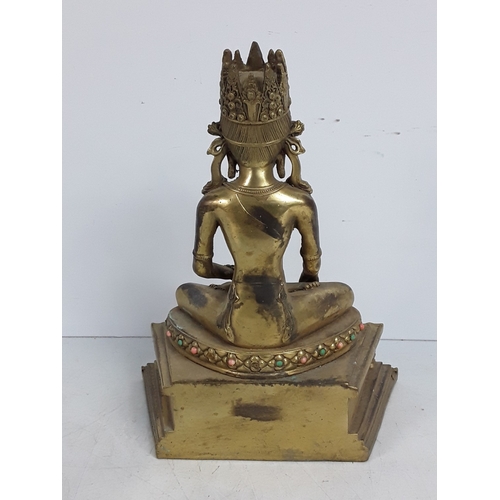 166 - Cast bronze stone set oriental goddess figure