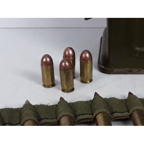 125 - Belt of M119 inert ammunition in period tin