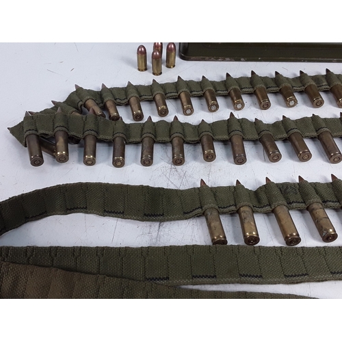 125 - Belt of M119 inert ammunition in period tin