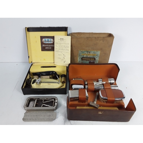 173 - Travelling iron, vanity set and razor stroop