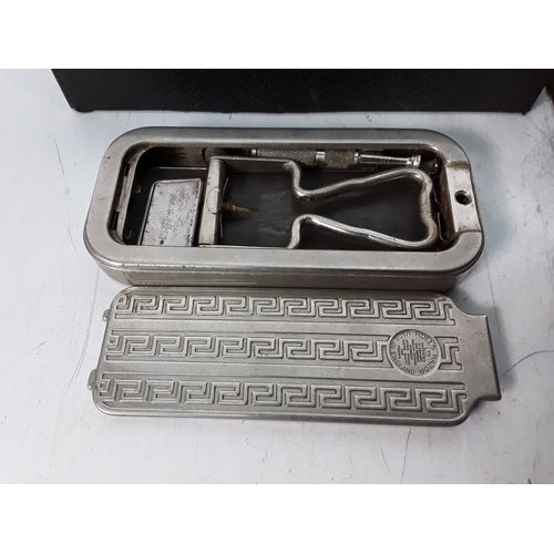 173 - Travelling iron, vanity set and razor stroop