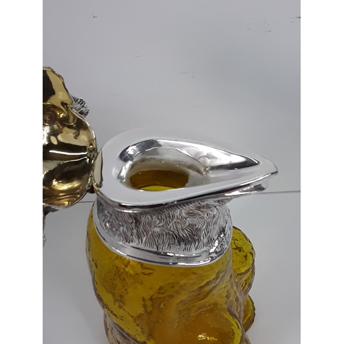 67 - Plated and glass claret jug in the form of a bear