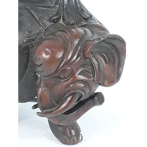 110 - Oriental cast bronze elephant figure, 23cms in height
