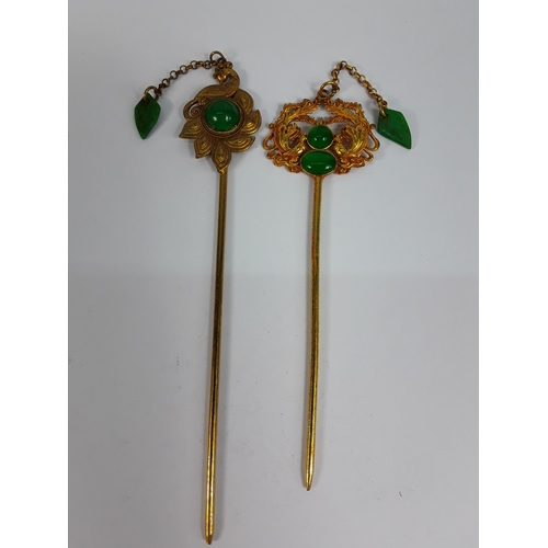 215 - Two Oriental hat pins