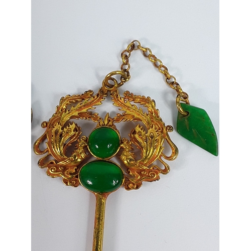 215 - Two Oriental hat pins
