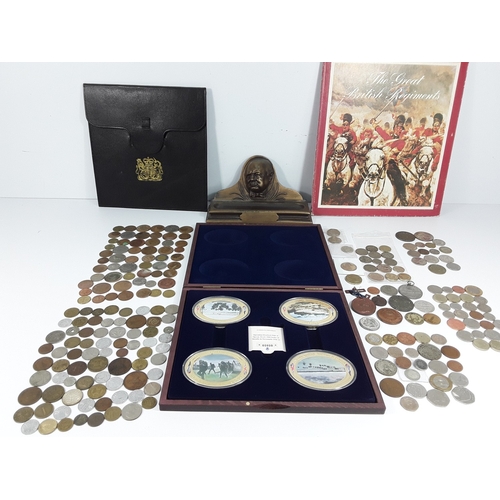 Selection of coins, plaques, pen holder etc
