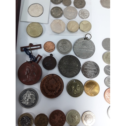 Selection of coins, plaques, pen holder etc