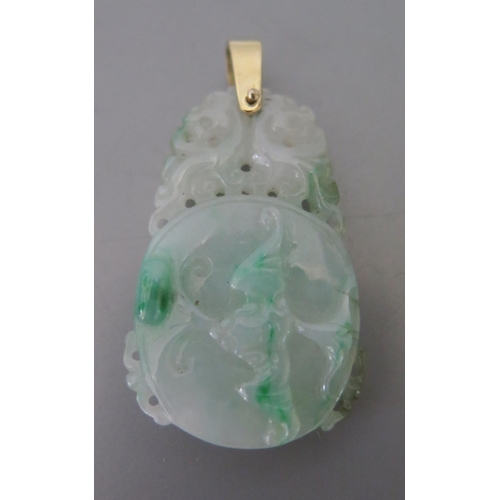 256 - A Chinese Carved Jadeite Pendant decorated with animals on a gold hanger, 42mm drop