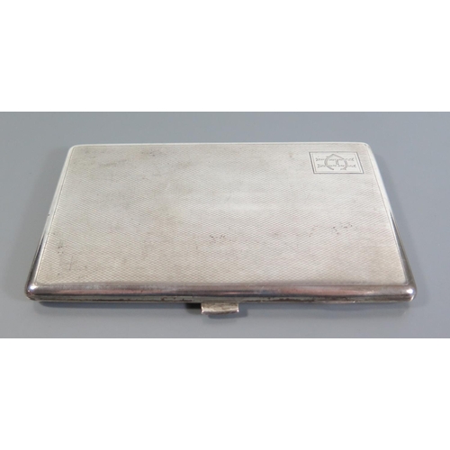 34 - A Sterling Silver Cigarette Case with engine turned decoration, 211g