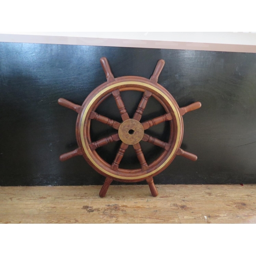 352 - A Heavy Ship's Wheel with brass inlay, c. 96 cm diameter