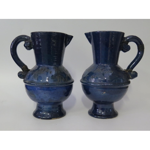 422 - A Pair of Clay Pits Ewenny Pottery Jugs with presentation inscriptions, 27cm, old staple repairs