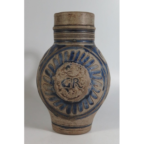 423 - A Westerwald Pottery Jug with incised decoration and initials GR, 23cm