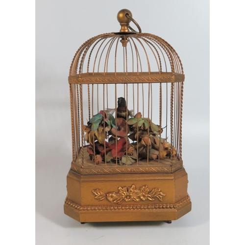 431 - An Automaton Singing Bird in cage, 27cm, in good working order