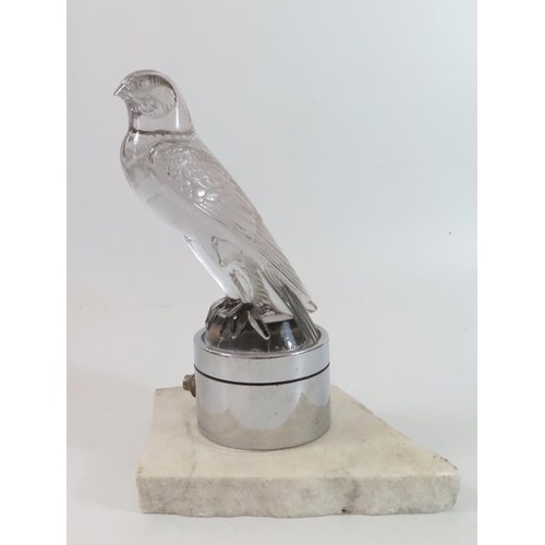 446 - A Lalique Glass Car Mascot, 'Falcon' no.1124, the polished clear glass body, embossed 'Lalique' and ... 