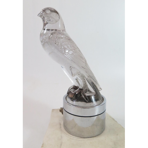 446 - A Lalique Glass Car Mascot, 'Falcon' no.1124, the polished clear glass body, embossed 'Lalique' and ... 