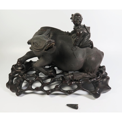 458 - A Nineteenth Chinese Carving of a Recumbent Water Buffalo with laughing figure on back and on a carv... 