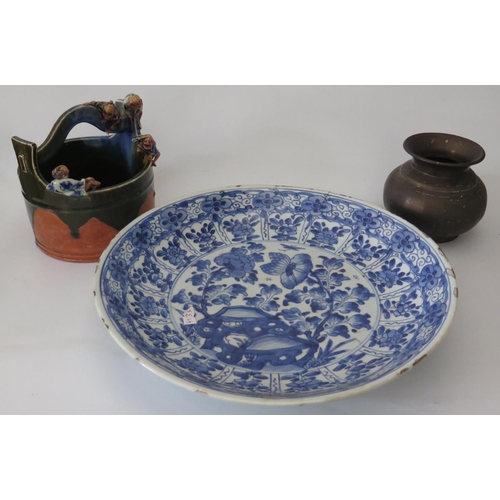 459 - An Eighteenth Century Chinese Blue and White Shallow Bowl decorated with flowers and central reserve... 