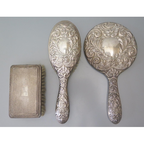 79 - An Elizabeth II Silver Hand Mirror and Brush Birmingham 1959 AND one other silver backed brush