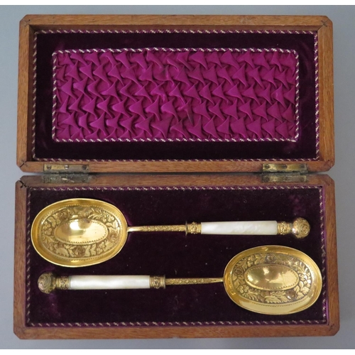 83 - A Victorian Oak Cased Gilt and Mother of Pearl Handled Serving Spoons, Martin, Hall & Co.