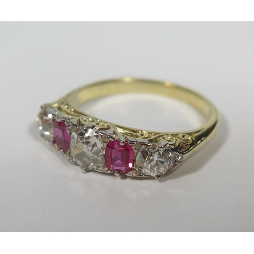 224a - A Ruby and Diamond Five Stone Ring in a yellow gold setting, principal stone c. .65ct, size N, 4.1g
