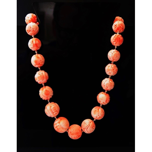 259 - A Chinese Carved Light Pink Coral Bead Necklace, 110.3g, 53cm long, largest bead 17mm