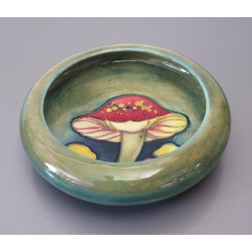 450 - A Moorcroft Claremont Dish decorated with mushrooms, 11.5cm