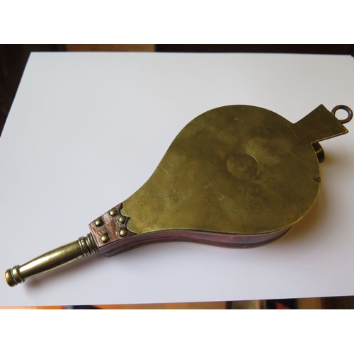 134a - A Novelty Copper and Brass Flask in the form of a pair of bellows, engraved with initials within a p... 