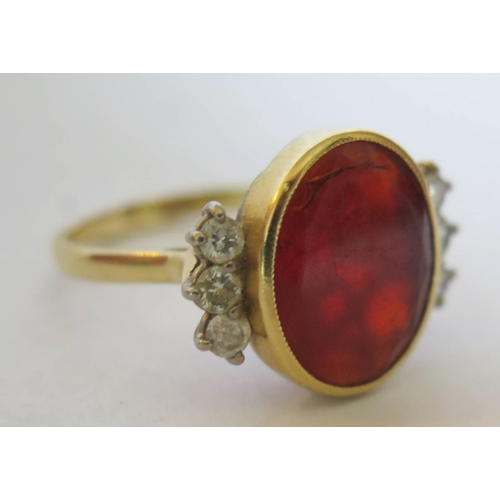 44b - An 18ct Yellow Gold, Carnelian and Diamond Dress ring, size P.5, 6.8g