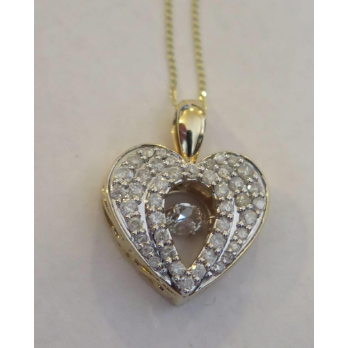 46g - A 9ct Gold Dancing Diamond heart Shaped Pendant on chain