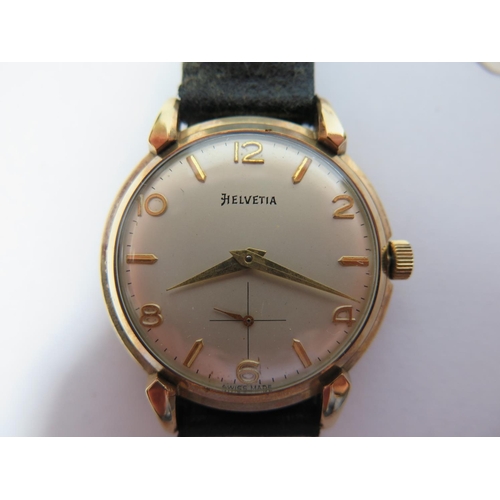 124 - An Helvetia 9ct Gold Gent's Manual Wristwatch, the 33mm dial with subsidiary seconds hand and 17 jew... 