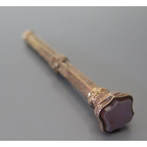 384 - A Victorian Yellow Metal Pencil with chased decoration and agate seal