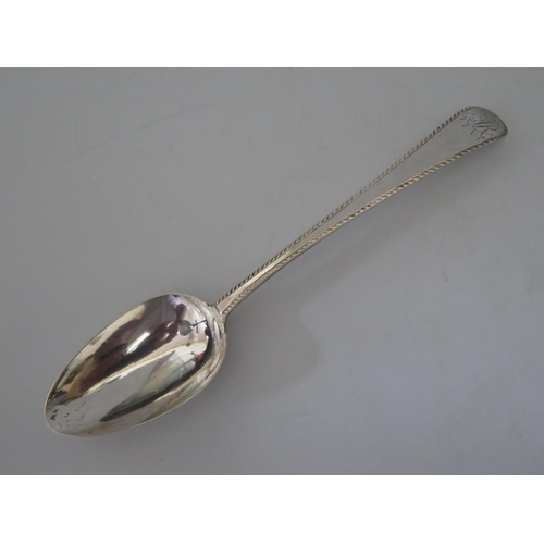 407 - A George III Silver Table Spoon with bright cut decoration, London 1780, Hester Bateman, 45g, 20cm