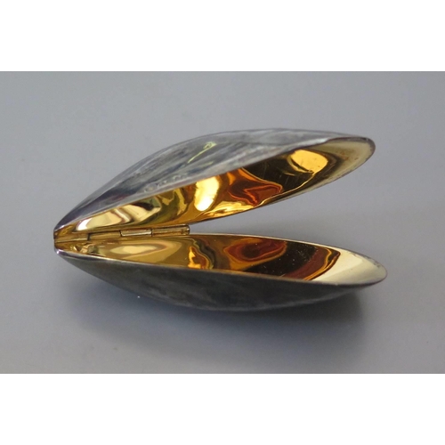 423B - A Modern London Silver and Gilt Lined Mussel Eater in the form of a mussel shell with spring hinges,... 