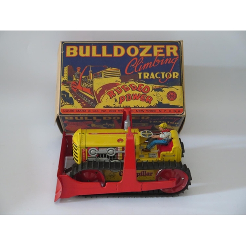 498 - Tin Plate Toy _ A Marx Bulldozer Climbing Tractor, 28cm. Manufactured in 1948 and complete with orig... 