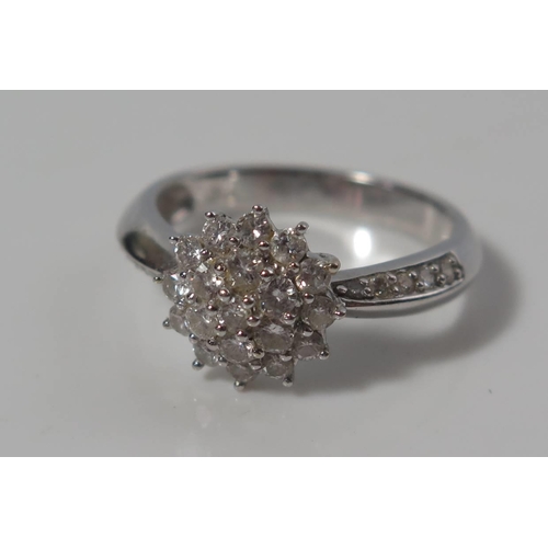 168 - A Diamond Cluster Ring in .750 stamped white gold setting, size M, 4.1g