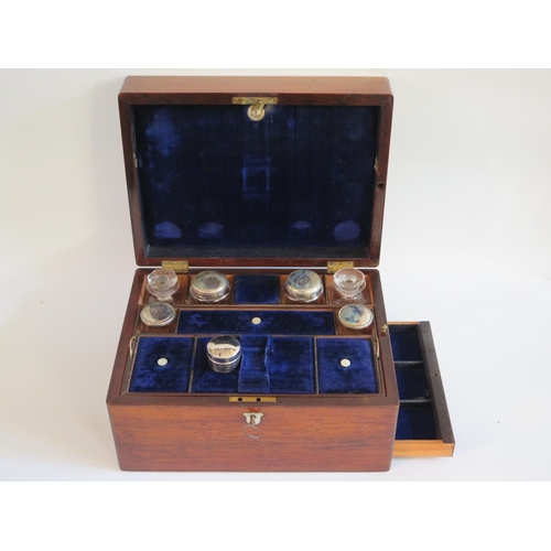 250 - A Victorian Rosewood Fitted Travelling Box with spring loaded slide to base