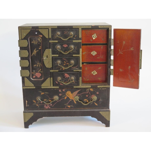 279 - A Japanese Lacquered Kodansu with foliate decoration