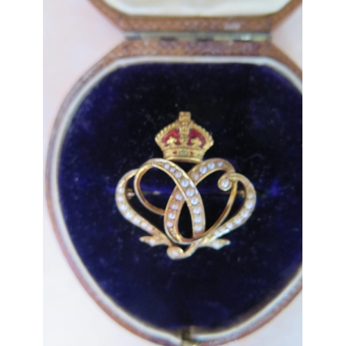 137 - An Elkington Boxed Precious Yellow Metal, Seep Pearl and Enamel Brooch with crown finial, 3.7g