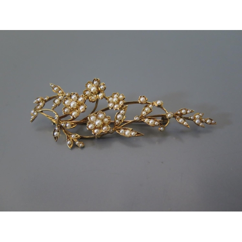 188 - A Seed Pearl Floral Spray Brooch in a precious yellow metal setting, 9.3g, 7cm