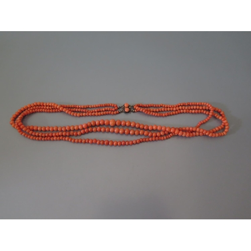 200 - A Three Strand Graduated Coral Bead Necklace, 51g