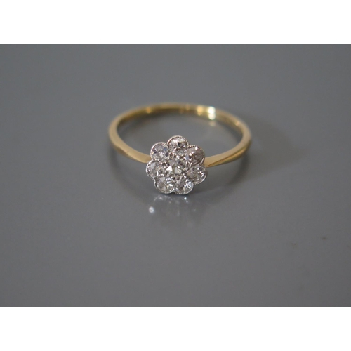 200H - A Diamond Cluster Ring in precious yellow metal setting, 2.1g