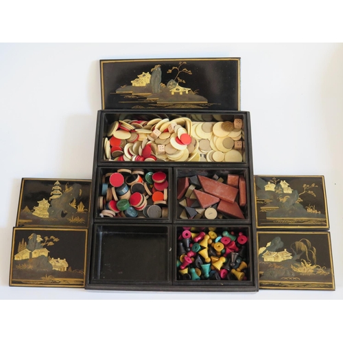 244 - A Nineteenth Century Chinese Export Lacquer Five Compartment Box containing various gaming counters