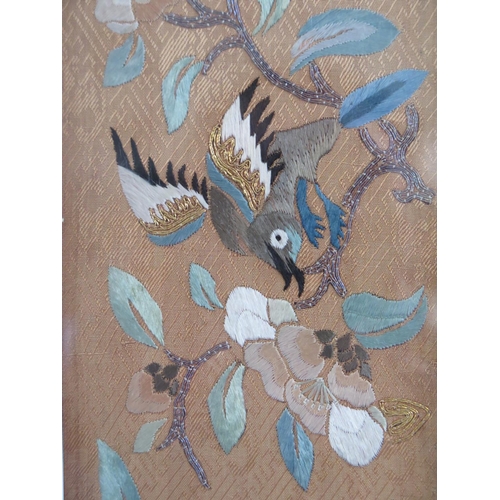 300 - A Pair of Chinese Silk Embroideries decorated with birds and foliage and highlighted with gold threa... 