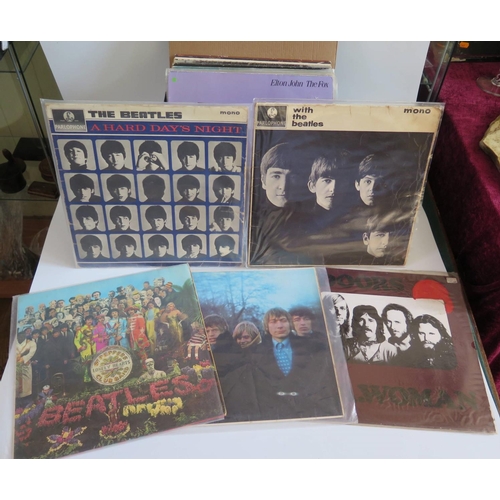 355 - A Selection of LP Records including Rolling Stones, Doors, Beatles, ELO, Elvis, ABBA etc