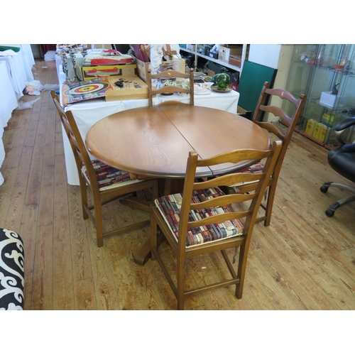 475 - An Ercol Dining Table and Four Chairs